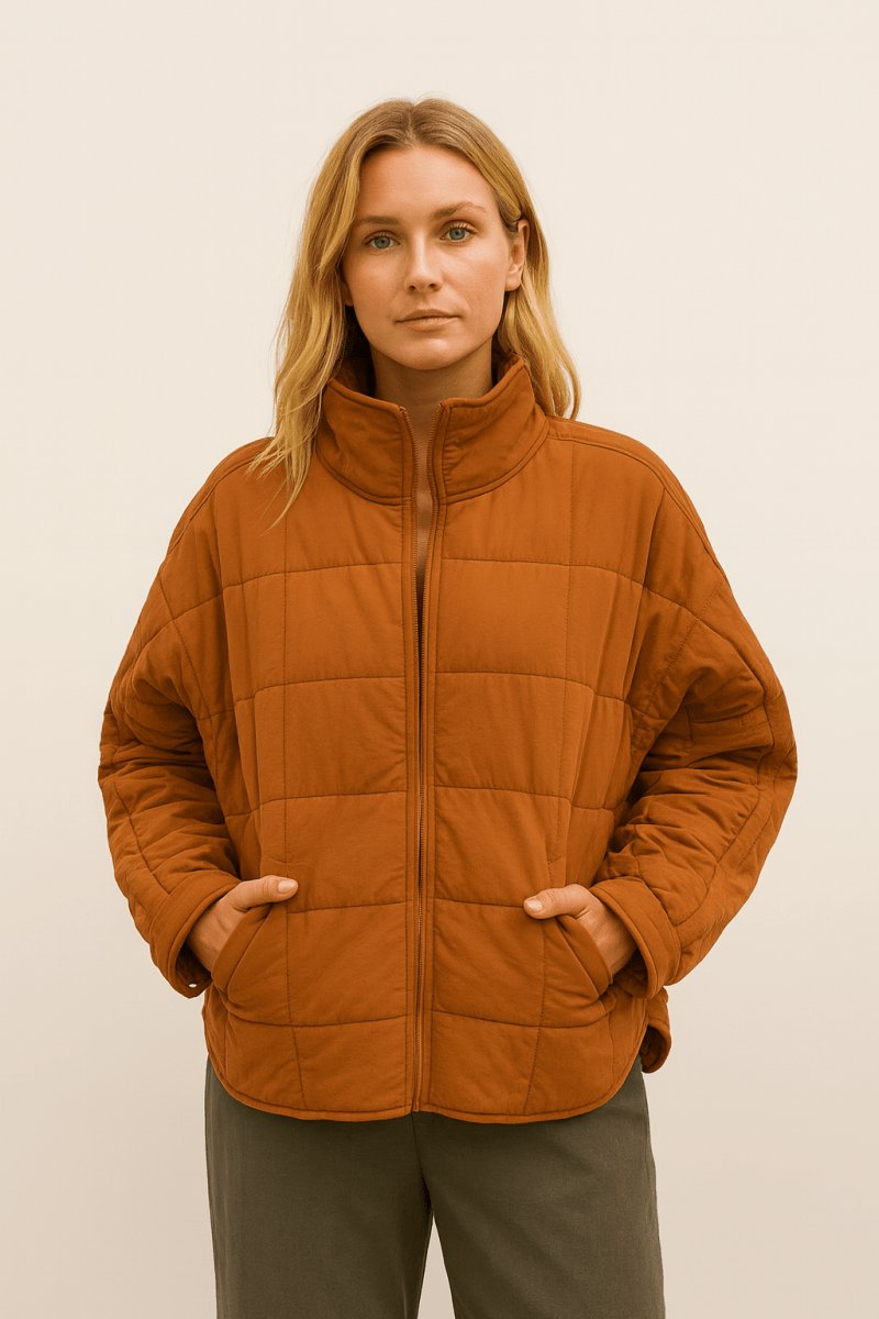 Hannah Lightweight Packable Puffer Jacket in orange - worn by a model, front view