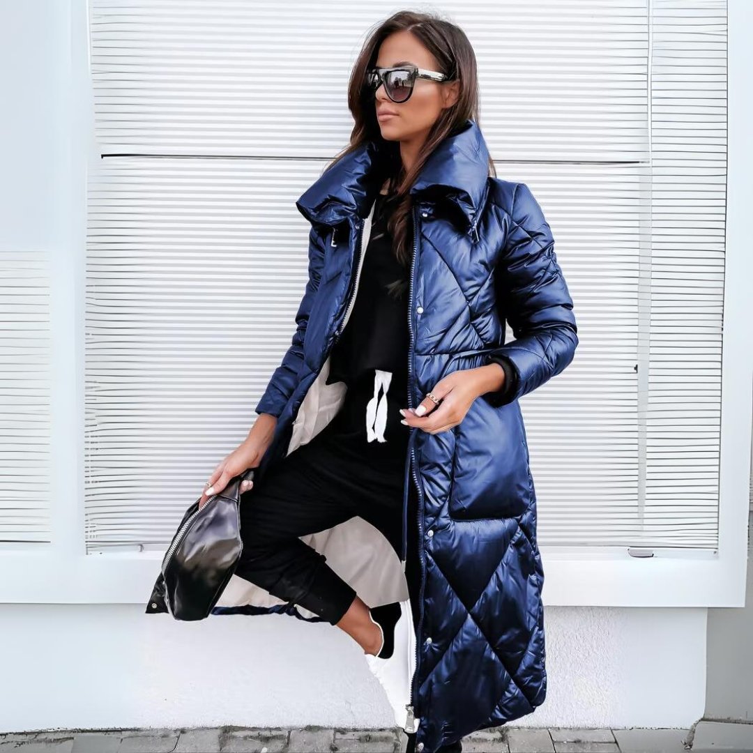 Layla Long Puffer Coat in blue - worn by a model outdoors