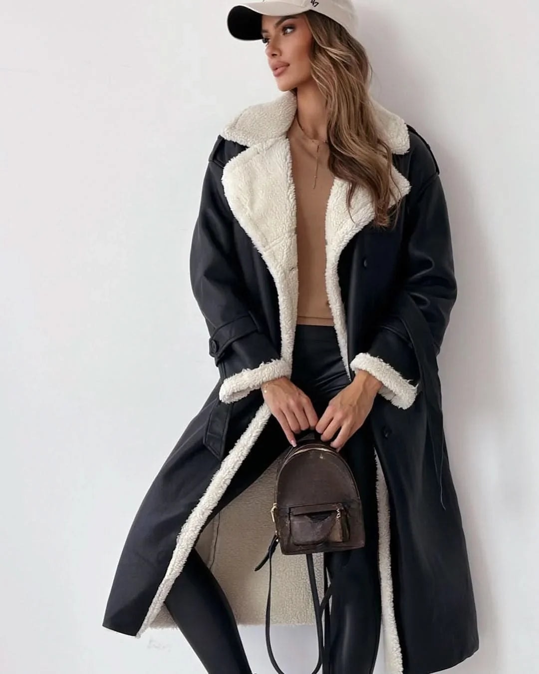 Shearling Trim Trench Coat in black - worn by a model, front view