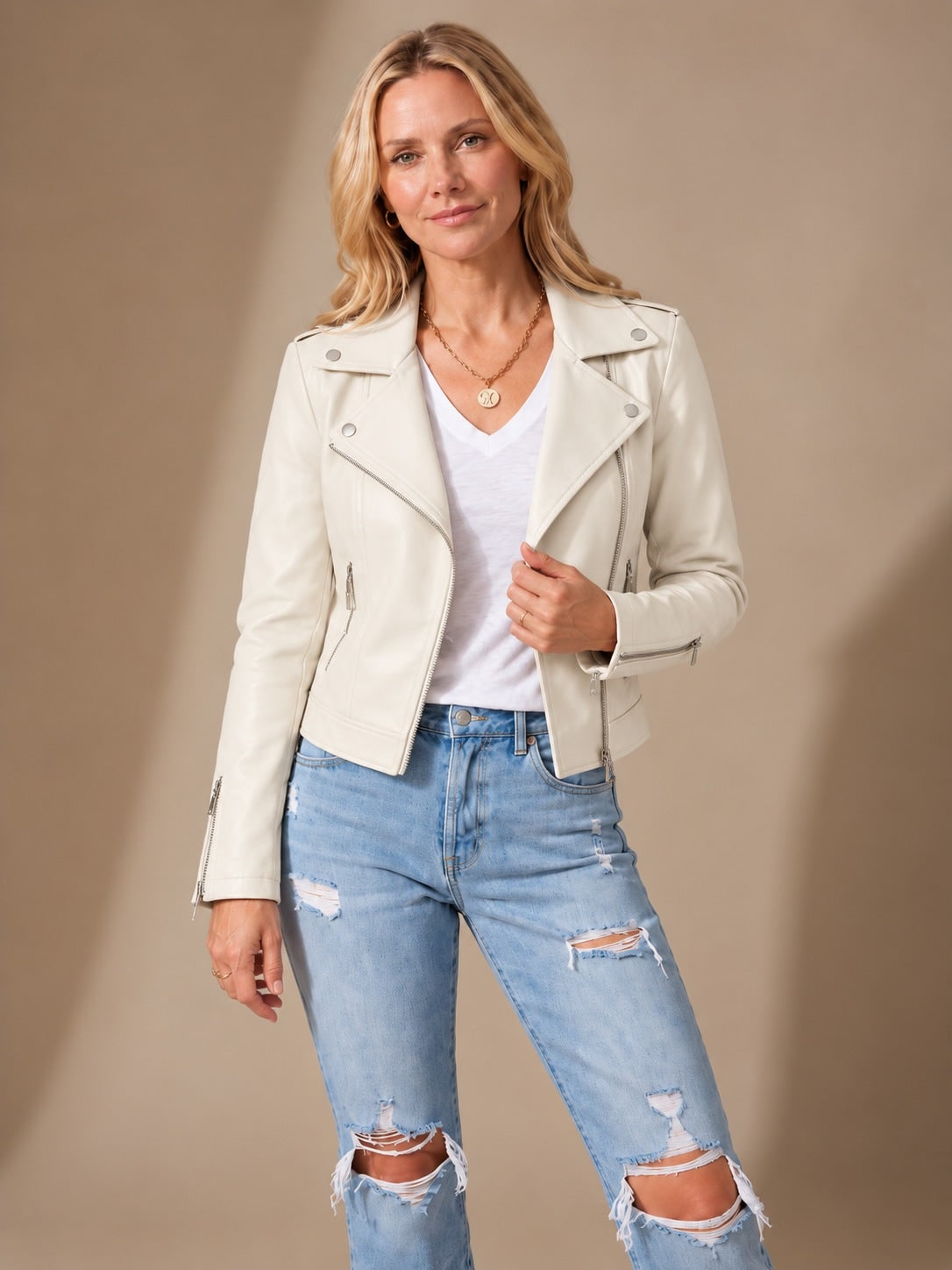 Ivory faux leather moto jacket worn with a white tee 4