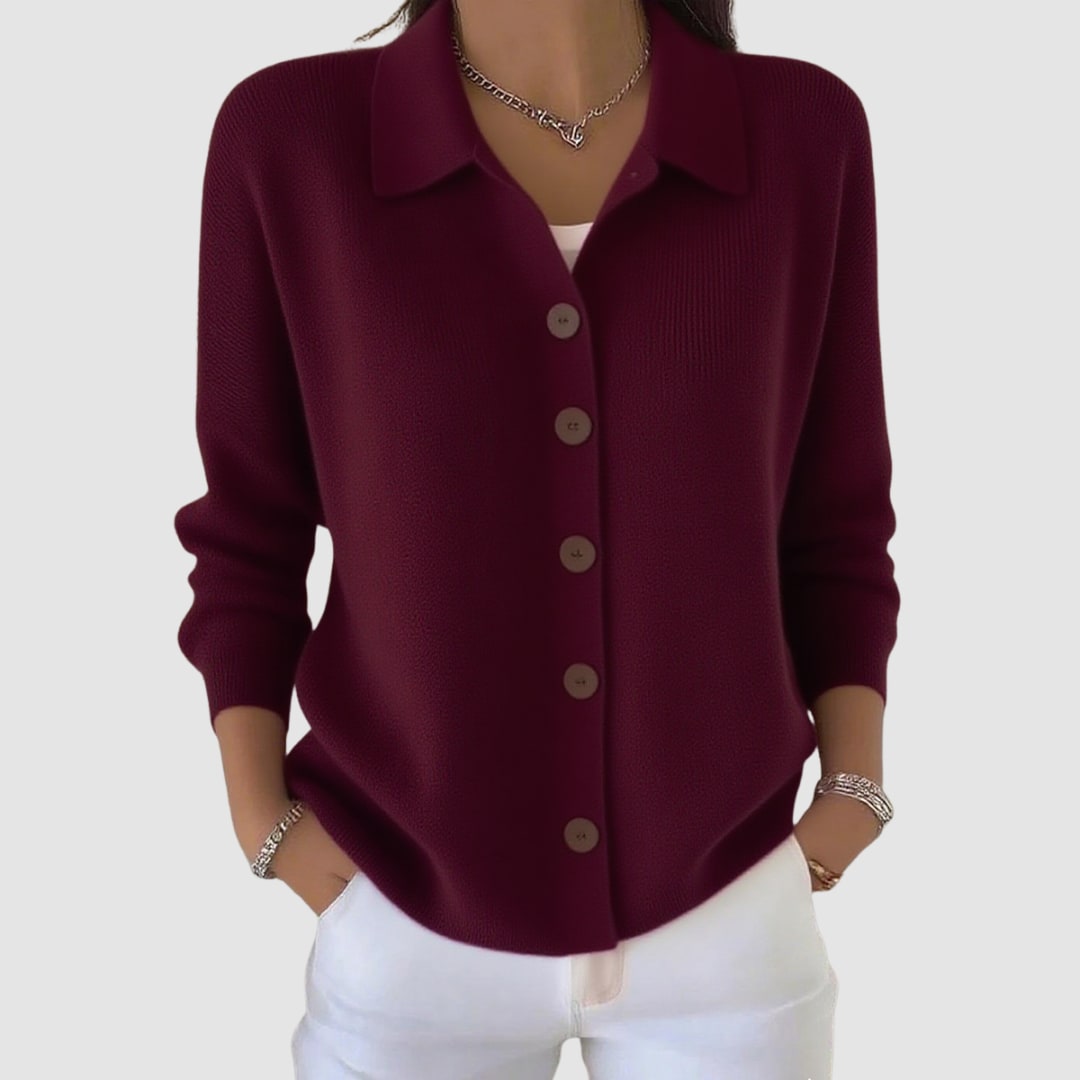 Wine red collared button cardigan worn with white trousers 1