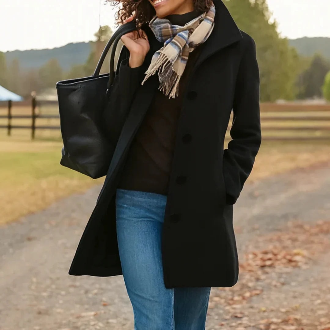 Heledd Longline Coat in Black - worn by a model outdoors