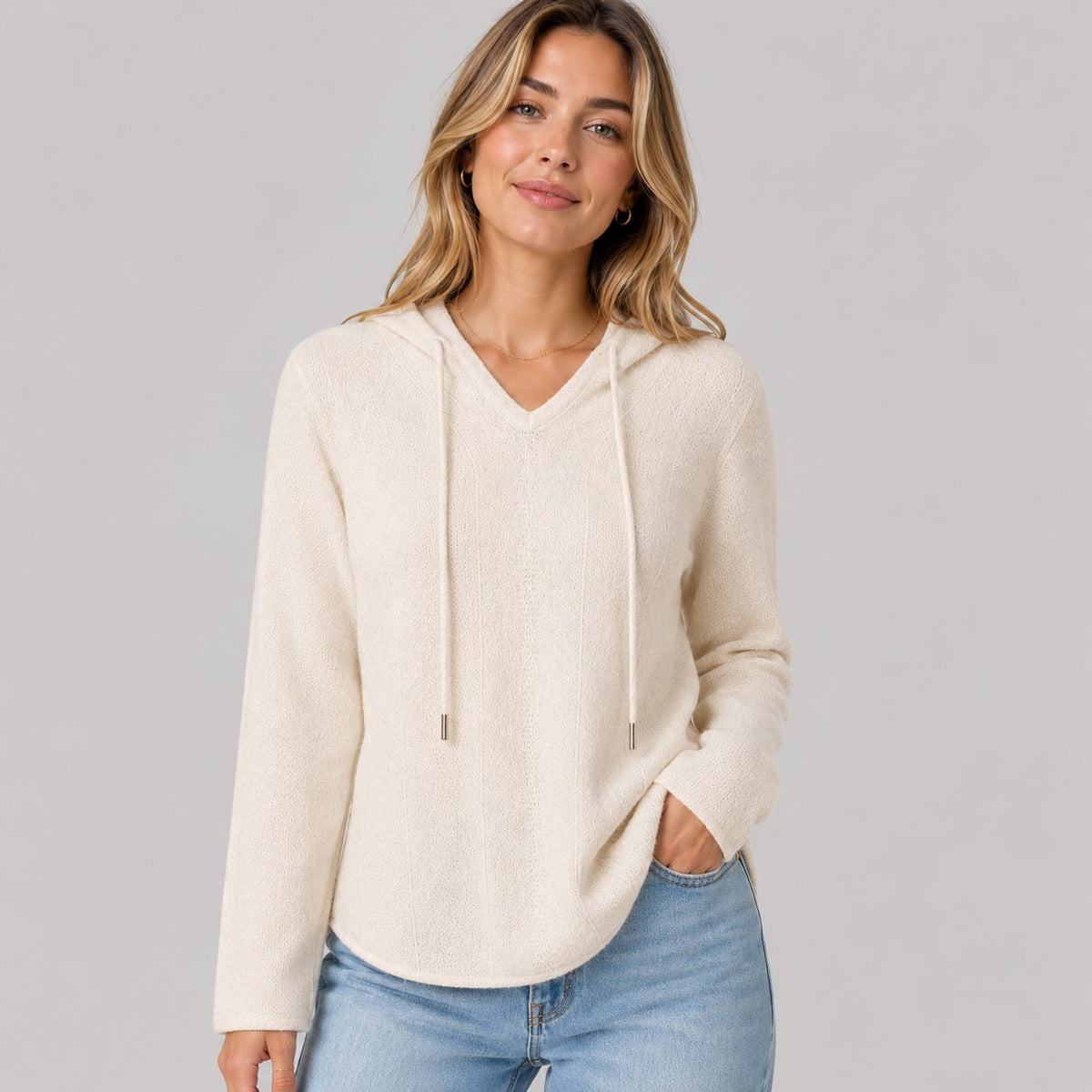 Hooded Knit Sweater in Light Tones in White - worn by a model, front view