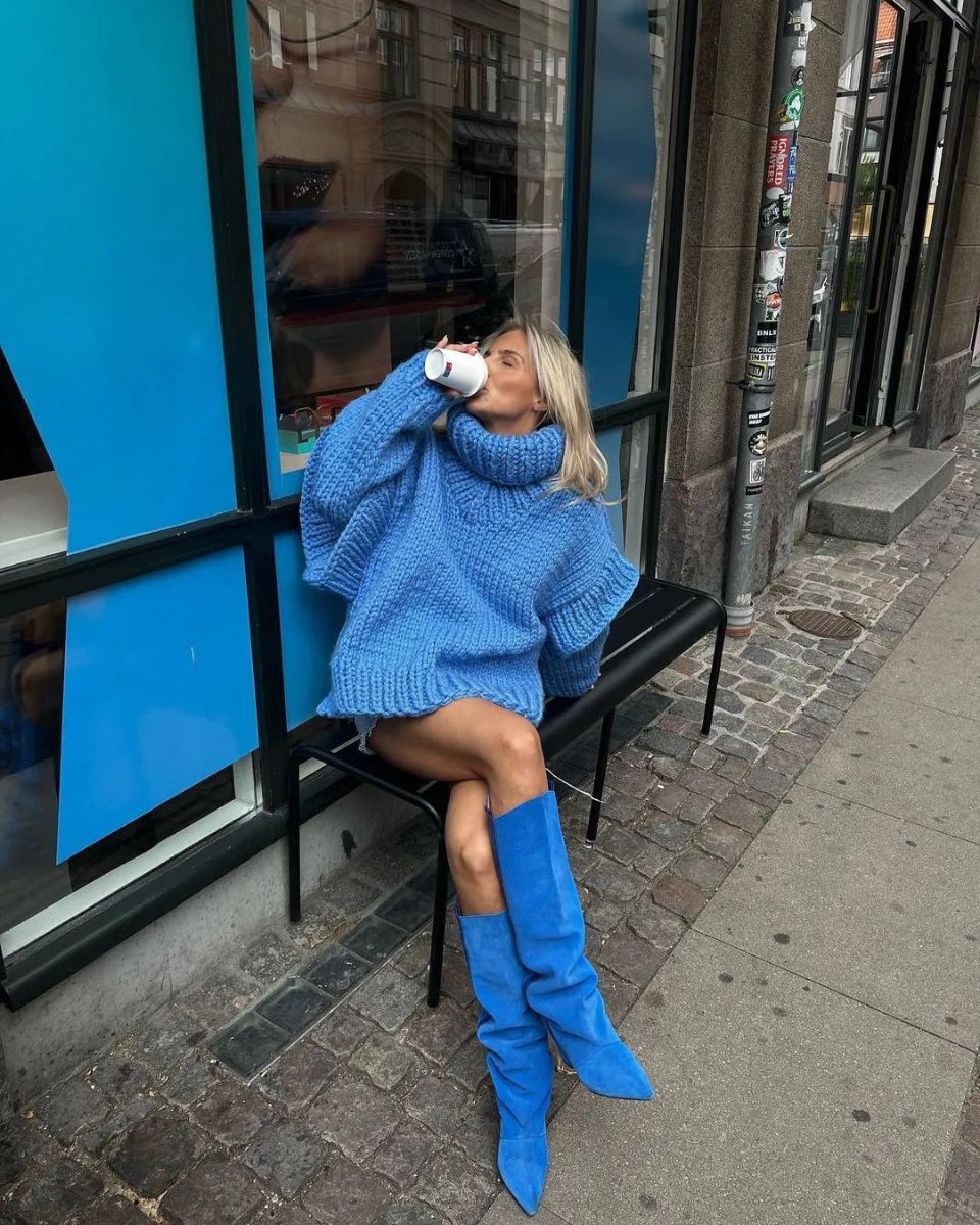 Knit Hooded Sweater in blue - worn by a model outdoors