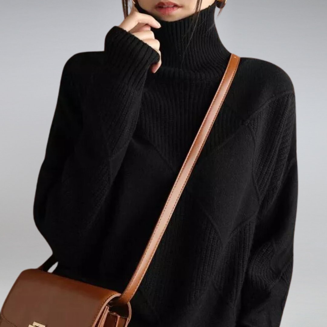 Penelope Soft Knit Turtleneck Sweater in Black - worn by a model, front view