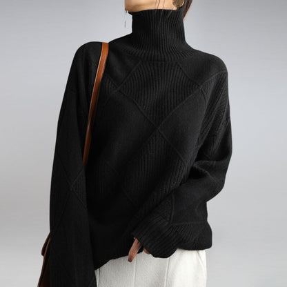 Penelope Soft Knit Turtleneck Sweater in Black - worn by a model, front view