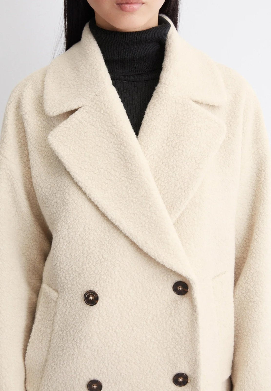 Petronille Double Breasted Pea Coat in Ivory Cream - close-up of the lapel