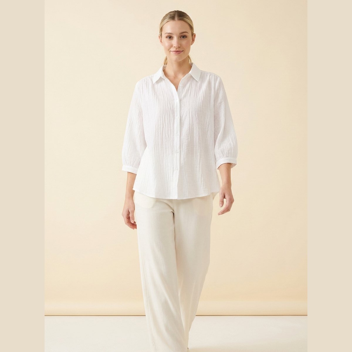 Pinky Oversized Shirt in White - worn by a model, front view