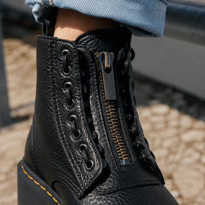 Close-up of the front zip and eyelets on the black platform boots 3