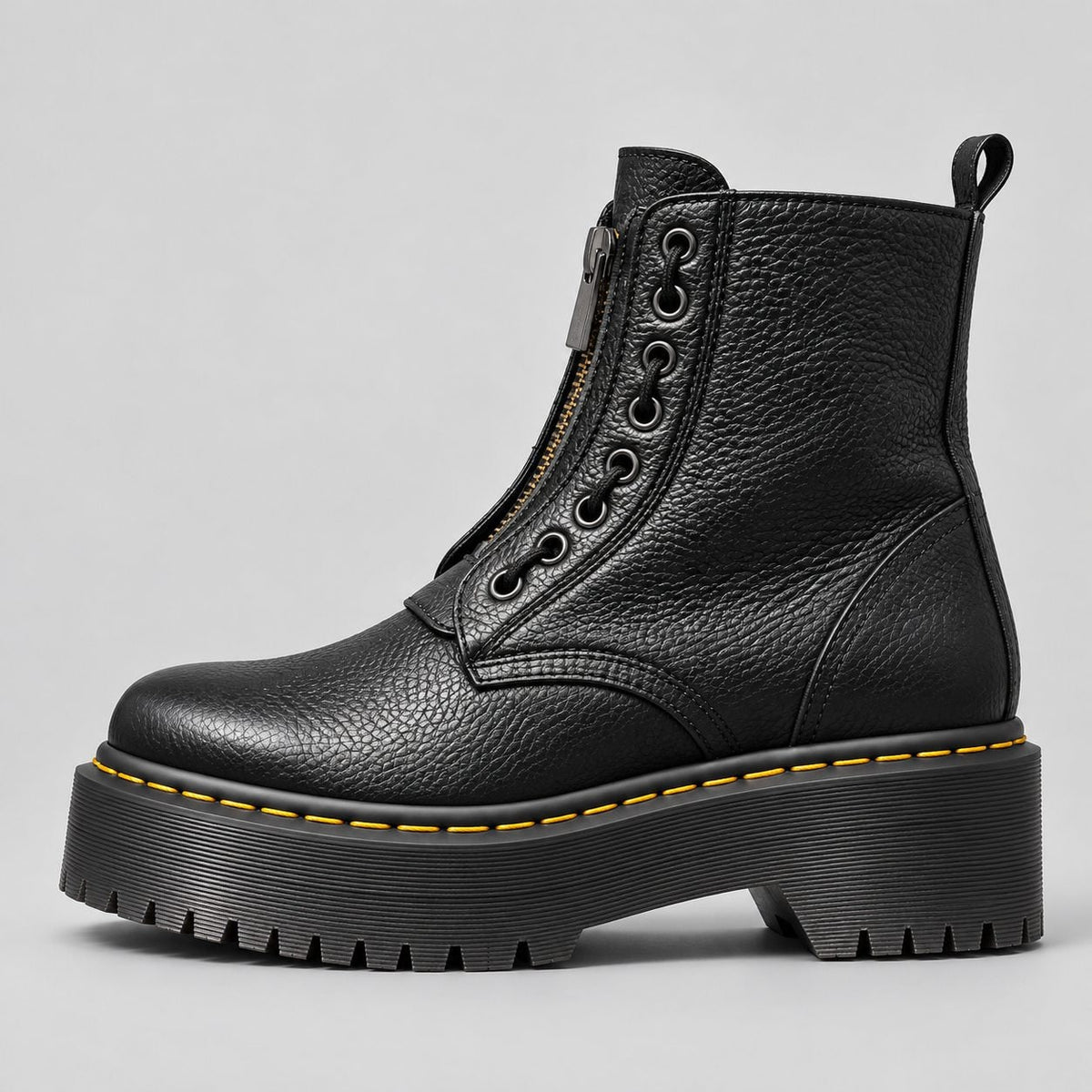 Side profile of the black boot with chunky ridged sole 4