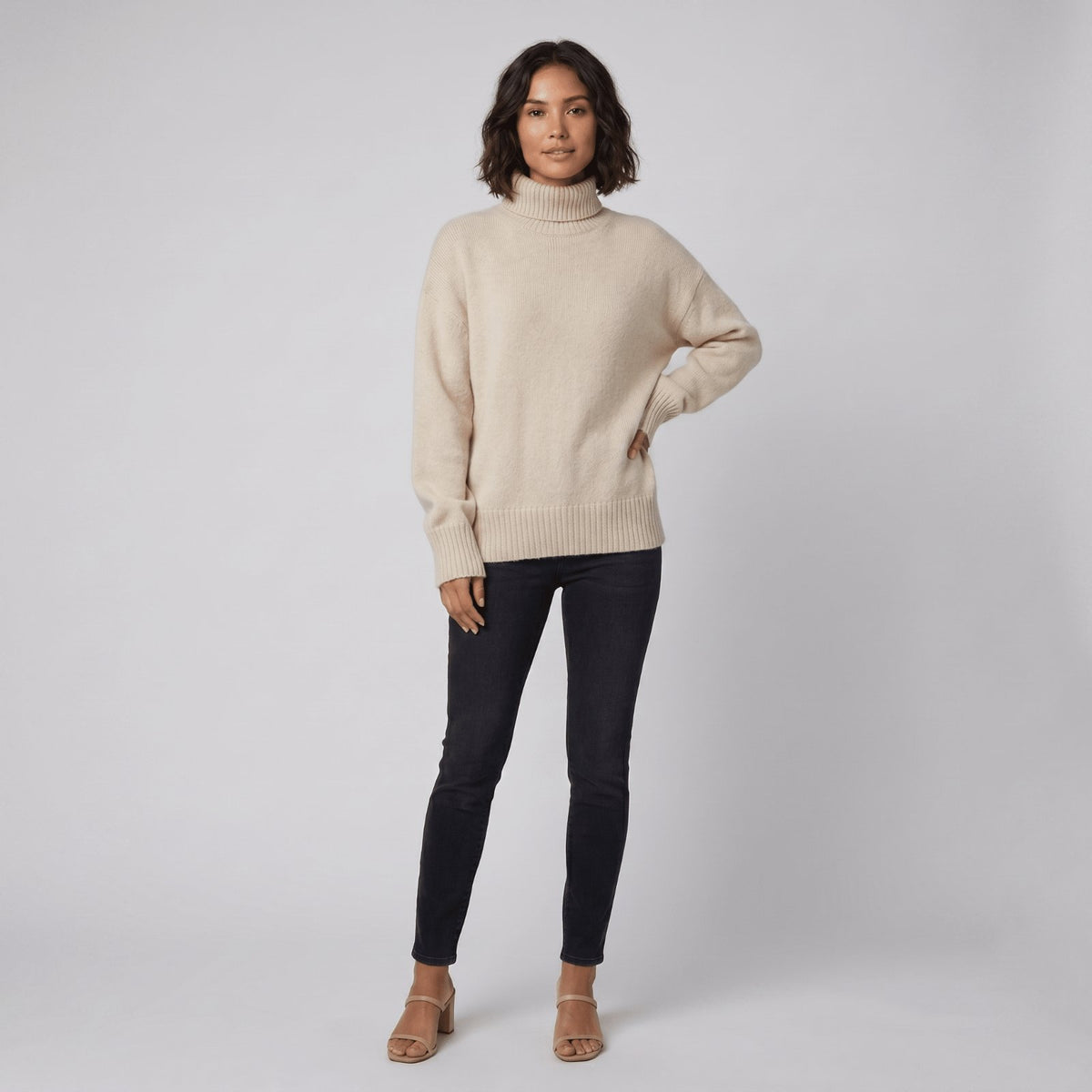 Soft Knit Turtleneck in Beige - worn by a model, front view