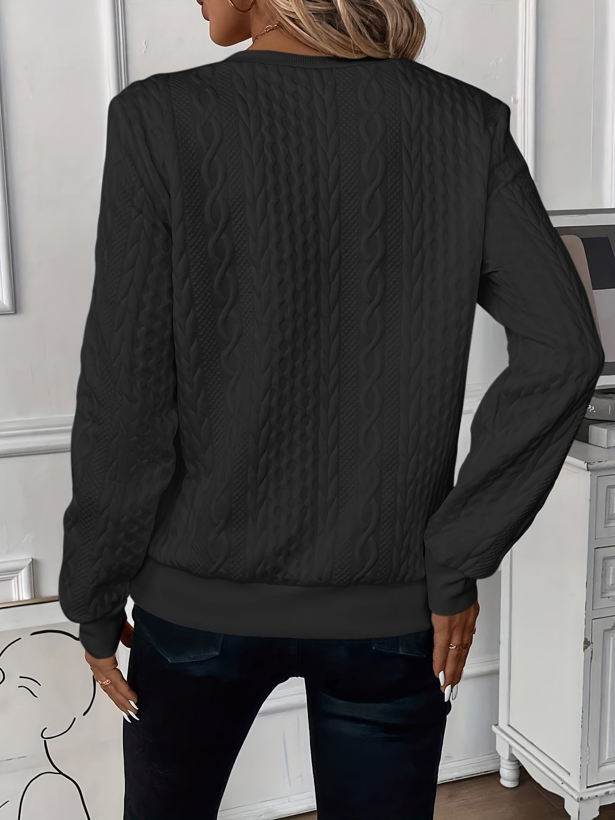 Back of the black textured sweater 9