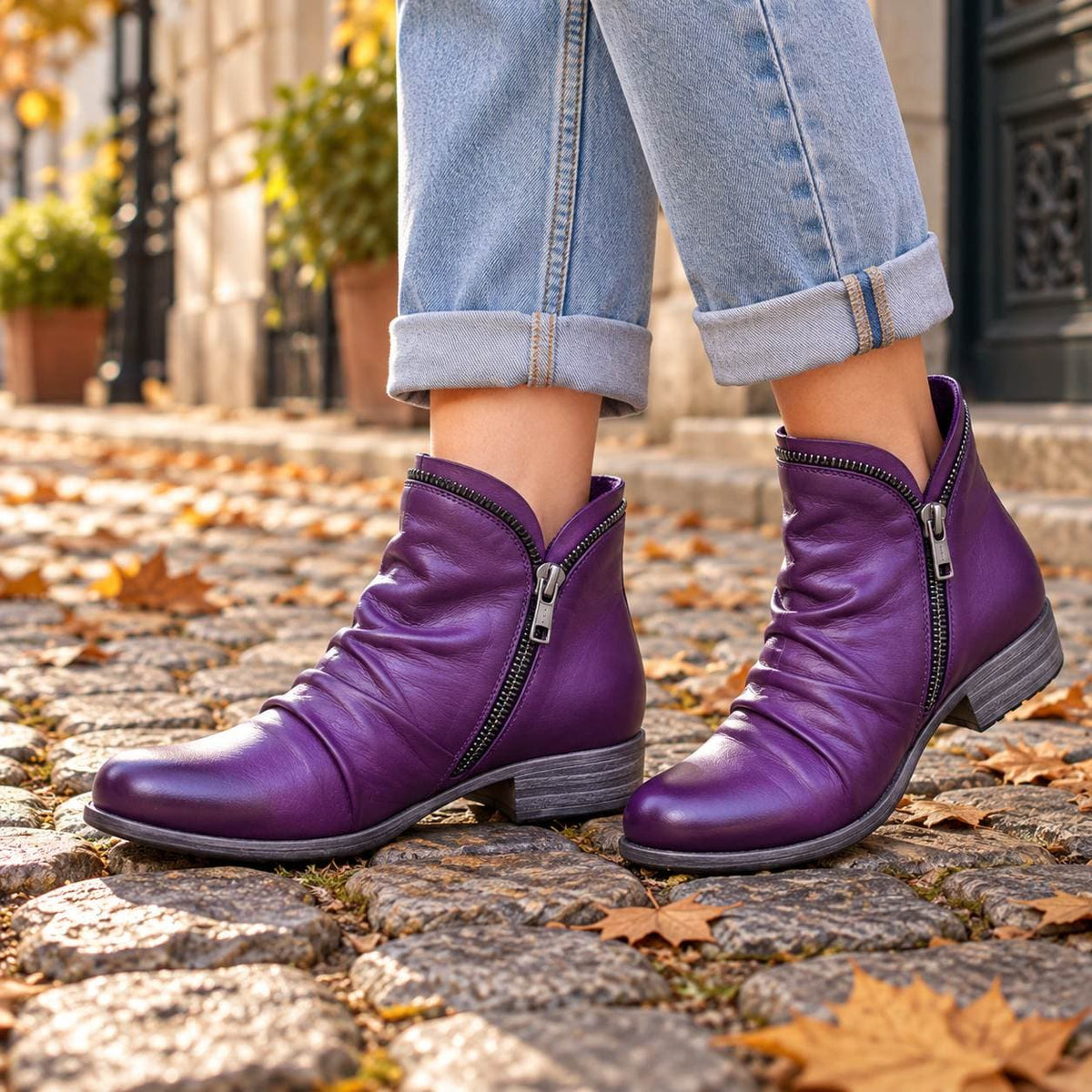 Purple faux leather ankle boots on cobblestones 4