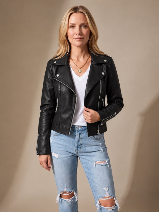 Black faux leather asymmetric zip moto jacket worn with a white tee and ripped jeans 1