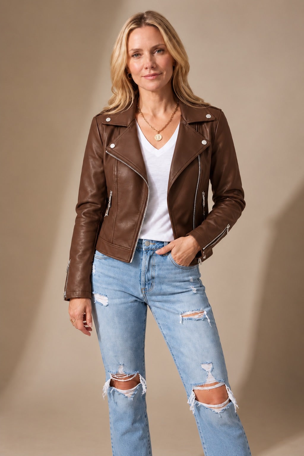 Brown faux leather moto jacket worn with a white tee 3