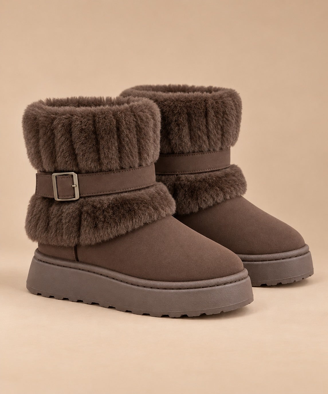 Coffee brown fur-trimmed slip-on snow boots with buckle strap, pair on a beige background 1
