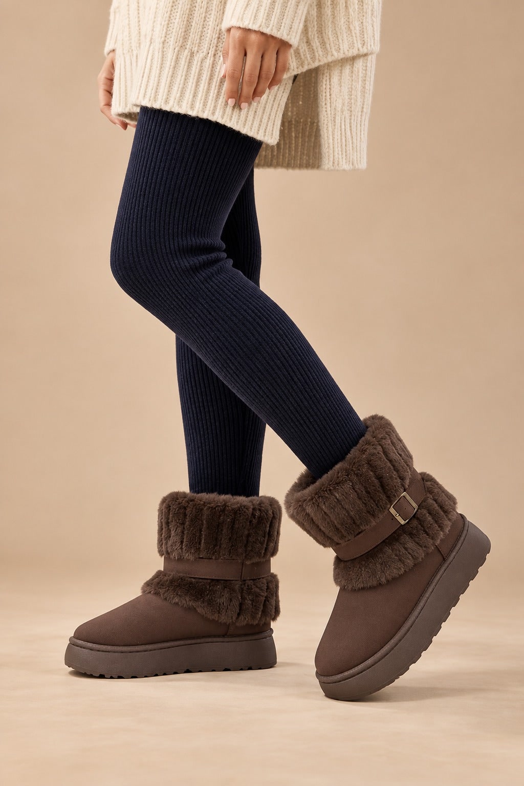 Brown fur-trimmed snow boots worn with dark leggings 2