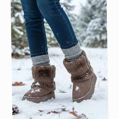 Brown fur-trimmed snow boots worn in the snow with wool socks 5