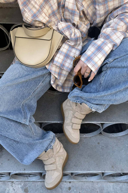 Beige hidden wedge sneakers worn with baggy jeans 9