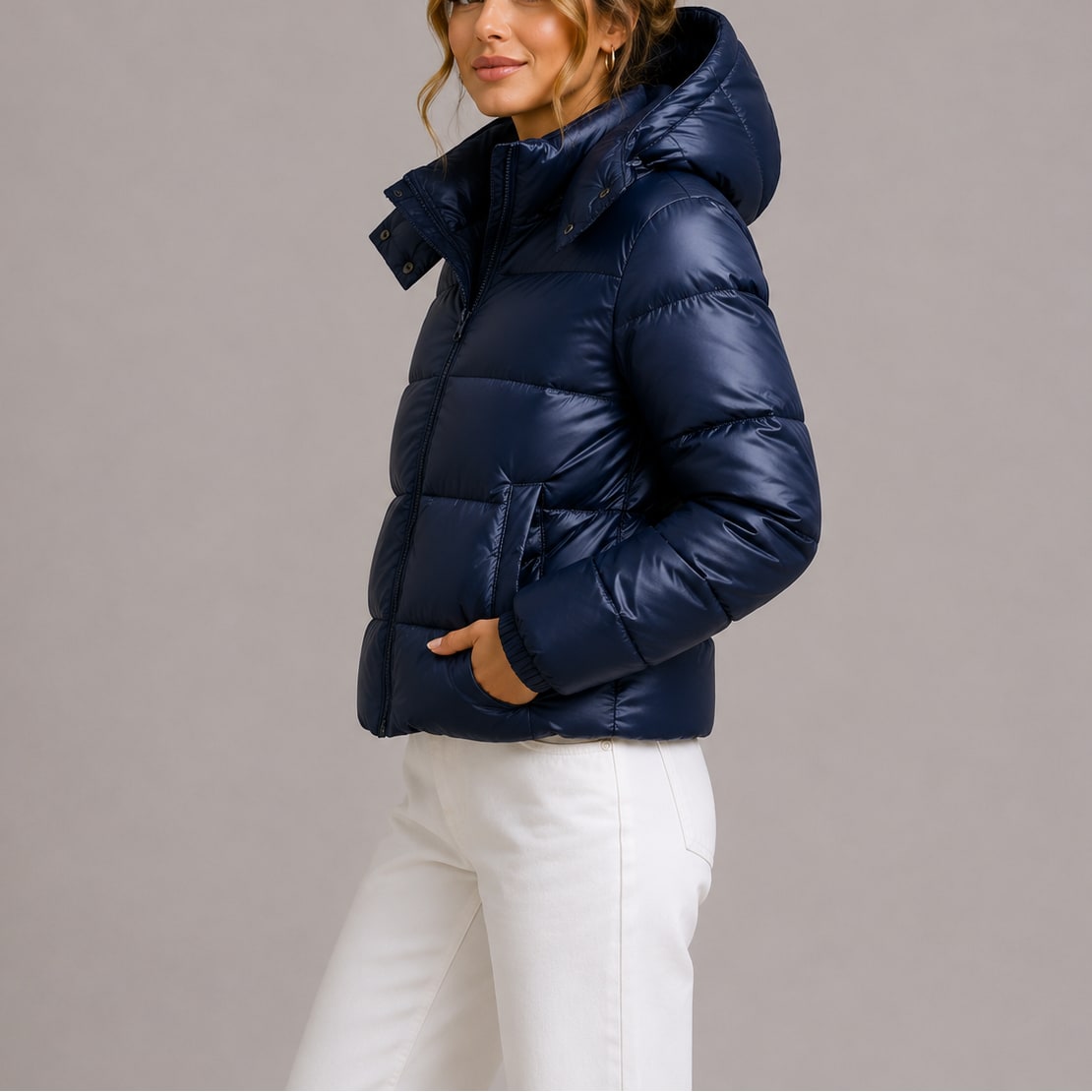 Navy hooded puffer jacket, side view with hand in pocket 2