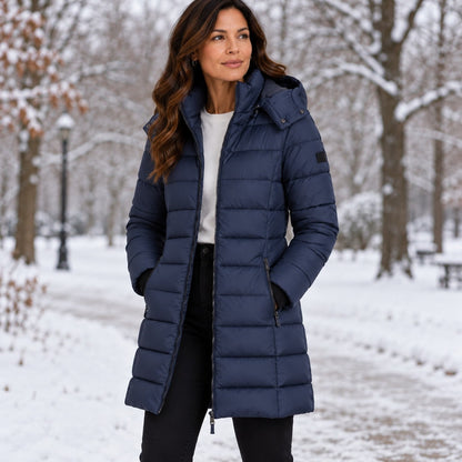 Navy long puffer coat with hood worn in a snowy park 3