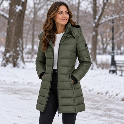 Green long puffer coat with hood in the snow 5