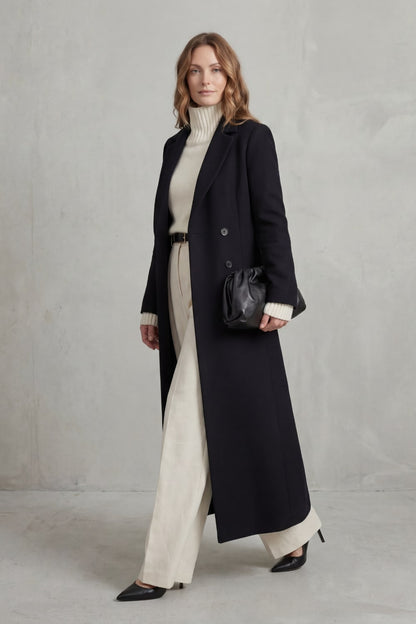 Black long tailored coat while walking 3