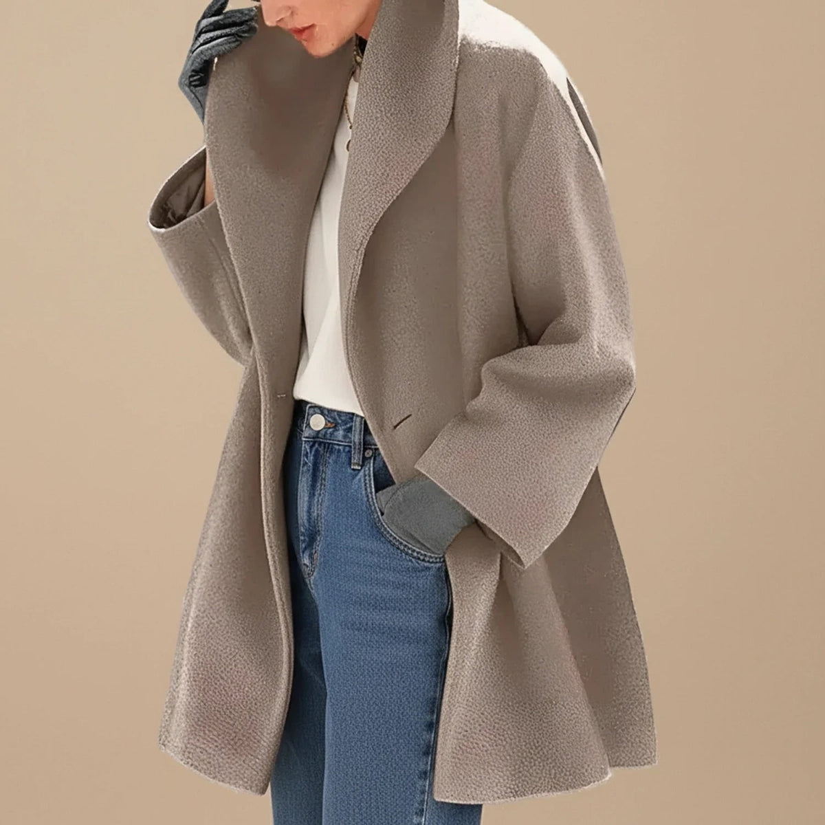 Brown A-line winter coat with wide collar worn with jeans 1