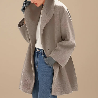Brown A-line winter coat with wide collar worn with jeans 1