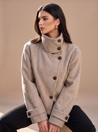 Beige short coat with stand collar, seated pose 2